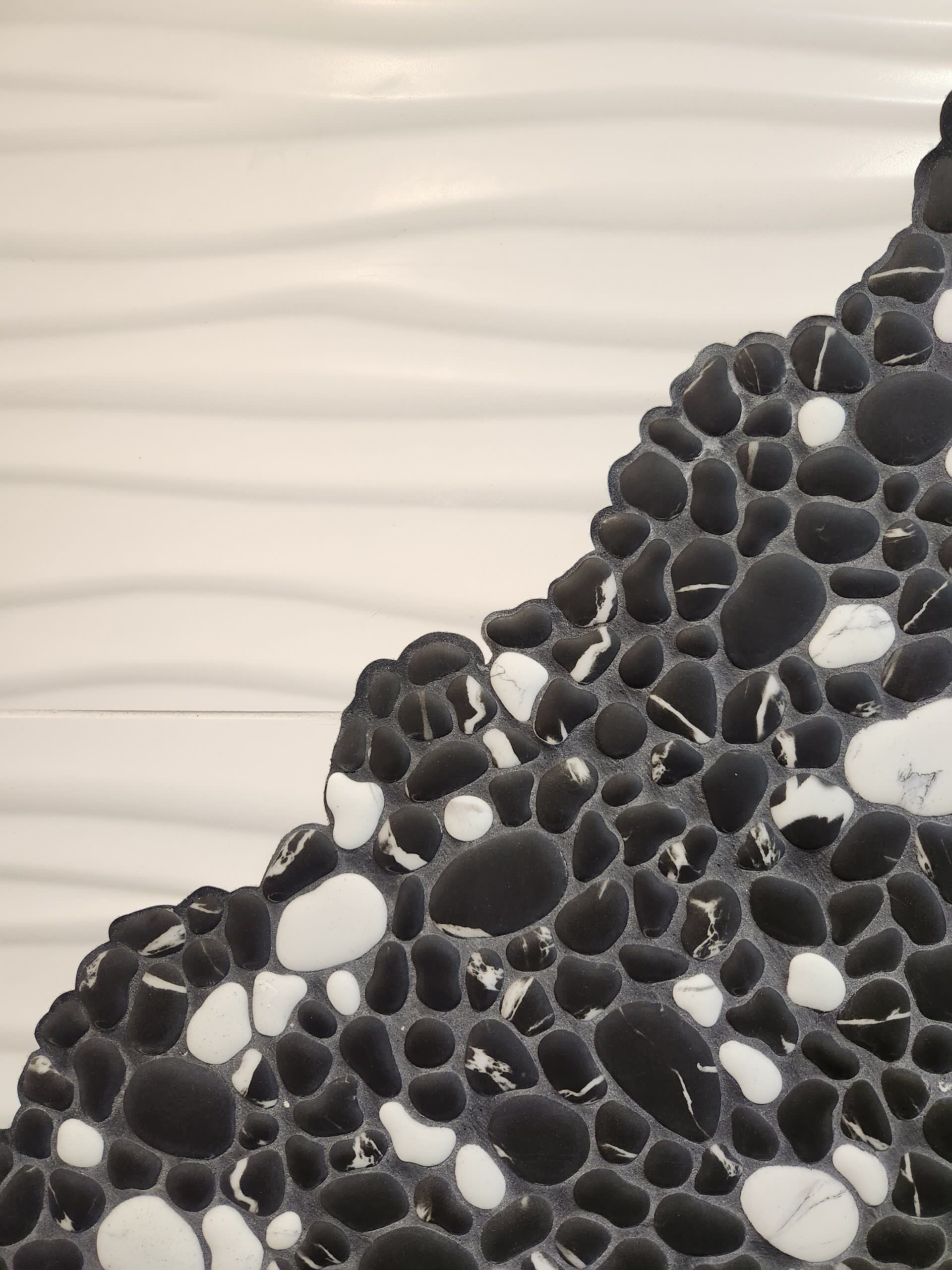 Black white pebble mosaic tile detail winter construction maine